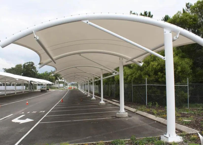 White membrane canopies over a parking area