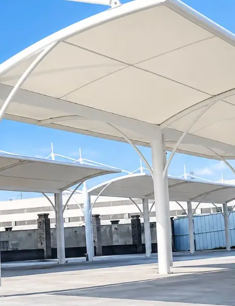 White roof modules over a parking area