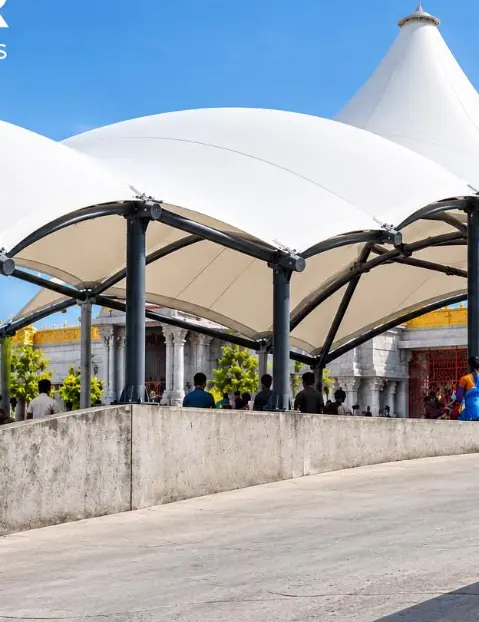 Curved white roofs over a public entrance