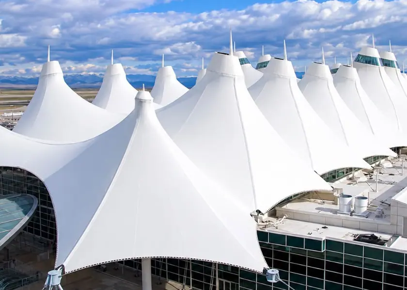 White architectural roof formed by tensile cones